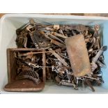 A tray of assorted car parts, chrome handles and bonnet catches included.