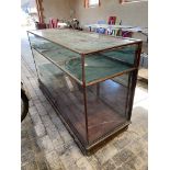 A large Victorian/Edwardian mahogany framed shop counter display cabinet, unusually having a high