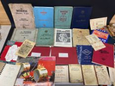 A box of workshop manuals and other motoring literature.