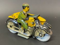 A small clockwork tinplate model of an AA motorcycle combination with rider, excellent condition.