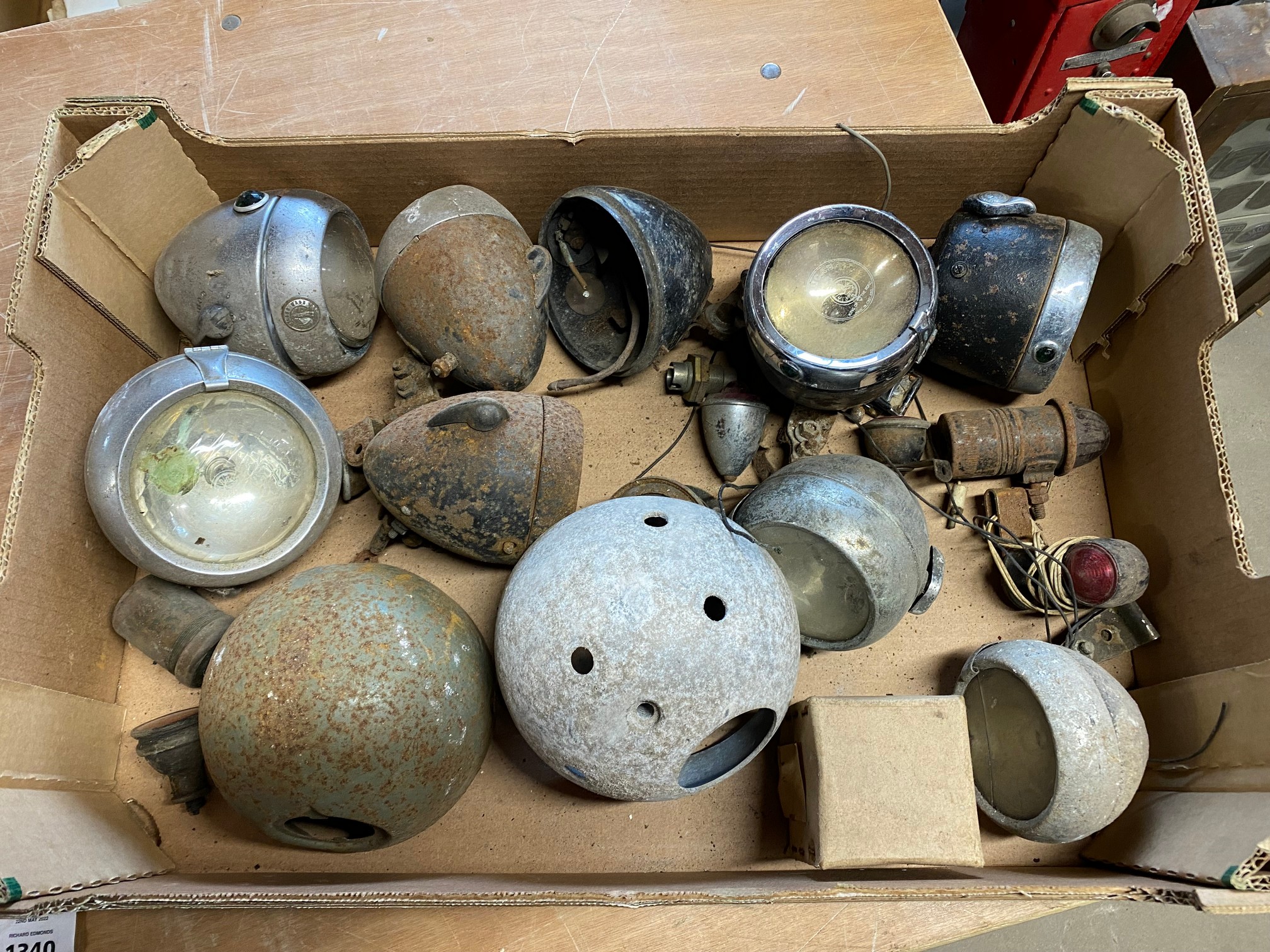 A box of bicycle and autocycle lamps.