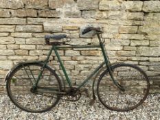 A tall gents bicycle with Dunlop leather saddle.