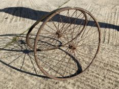 A pair of bath chair wire wheels.