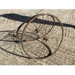 A pair of bath chair wire wheels.