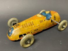 A Mettoy clockwork tinplate model of a single seater racing car.