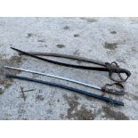 Two swords, both with metal scabbards.