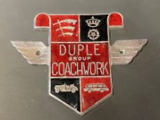 A Duple Group Coachwork chrome plated and enamel badge.