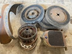 Six assorted wheels including Austin 7, an early Morris Commercial radiator and two wings.