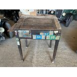 An early 20th Century desk with rising lid, as removed from a garage and still with sundry