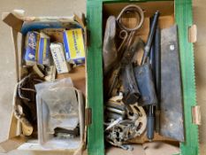 Two boxes of assorted bicycle parts including saddle, hub etc.