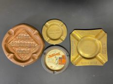 Four assorted advertising ashtrays including Sifta table salt.