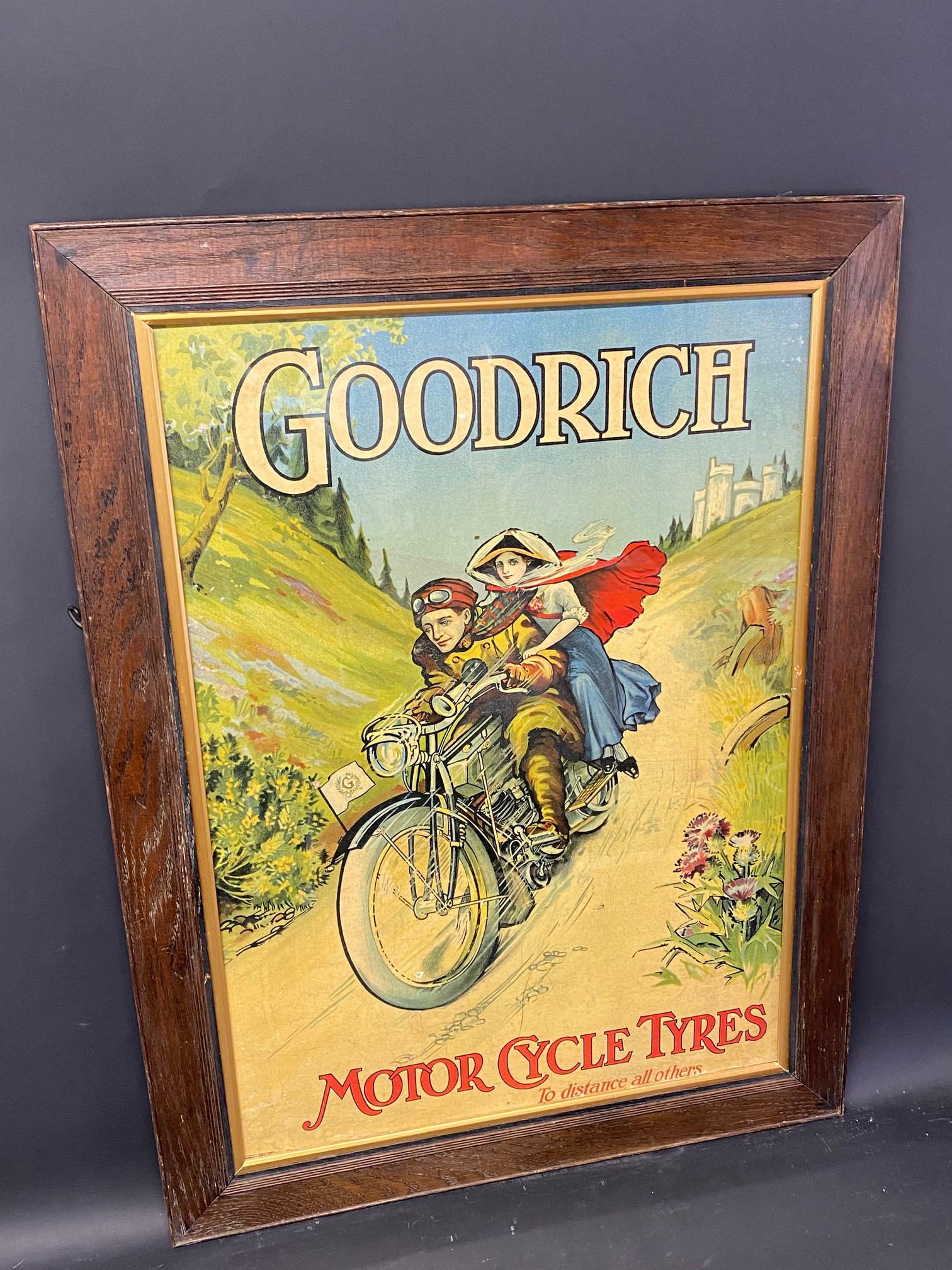 A superb pictorial showcard advertising Goodrich Motor Cycle Tyres depicting a gentleman and lady on