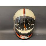 A rare Champion wall clock in the form of a racing helmet, in very good condition.