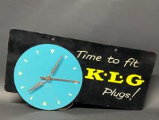 A K.L.G. Plugs garage showroom advertising wall clock, 18 x 10".