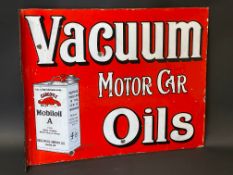 An early Vacuum Motor Car Oils double sided enamel sign with hanging flange, by Wildman & Meguyer,