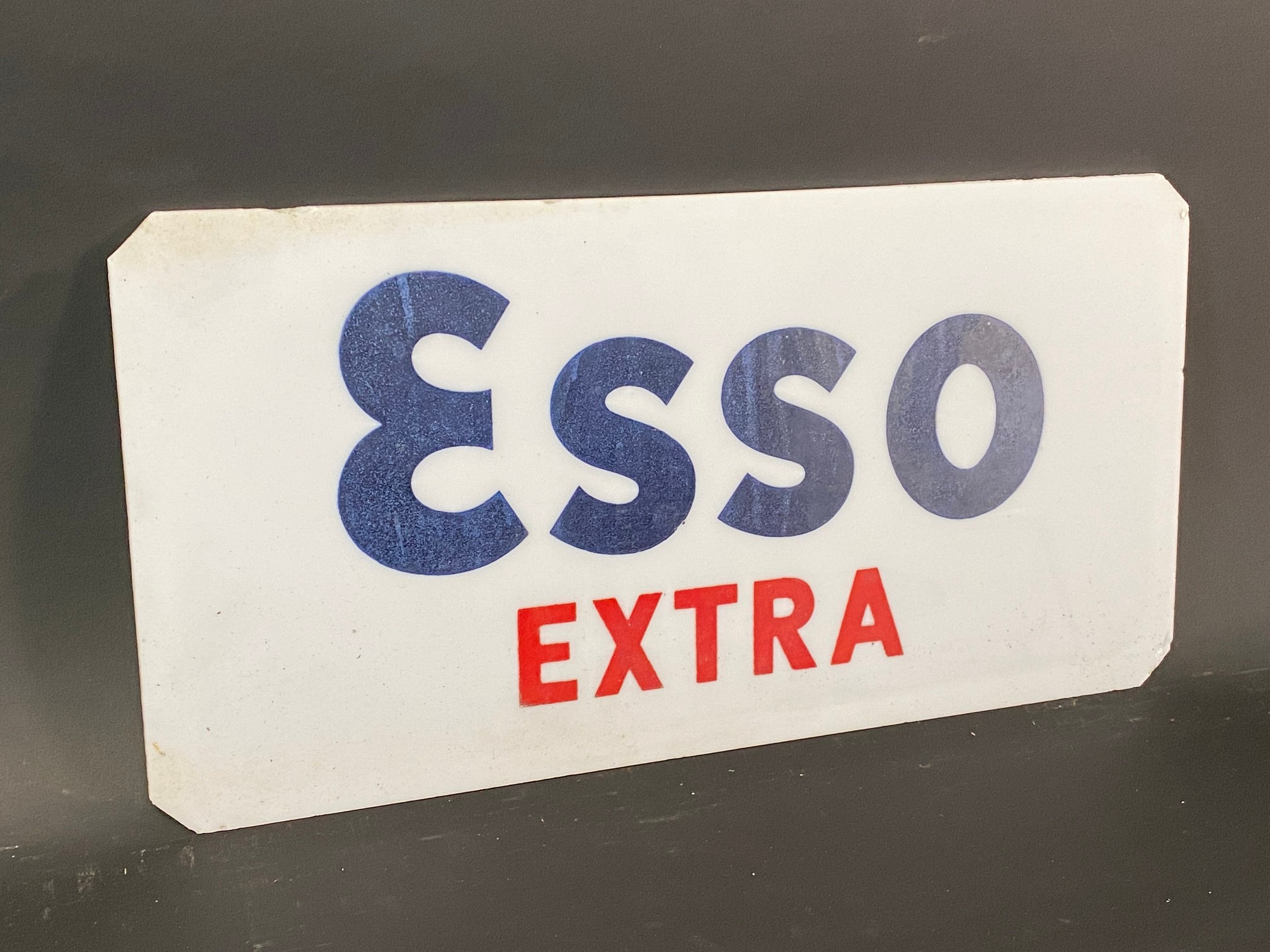 An Esso Extra milk glass petrol pump brand insert, 12 1/2 x 6 1/2".