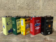 Five gallon oil cans including Solar Motor Oil.