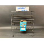 A Speedwell counter top point of sale rack with advertising sign to the pediment, also containing