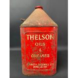 A Thelson Motor Oil five gallon pyramid can.