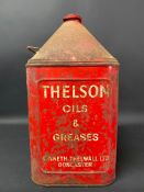 A Thelson Motor Oil five gallon pyramid can.