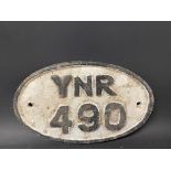A small oval cast iron plaque, YNR 490, possibly railway, 9 1/2 x 6".
