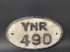 A small oval cast iron plaque, YNR 490, possibly railway, 9 1/2 x 6".