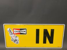 A new old stock Champion spark plug garage tin advertising sign 'In', 23 x 10".