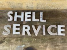 A set of original circa 1950s garage forecourt aluminium letters spelling Shell Service, in