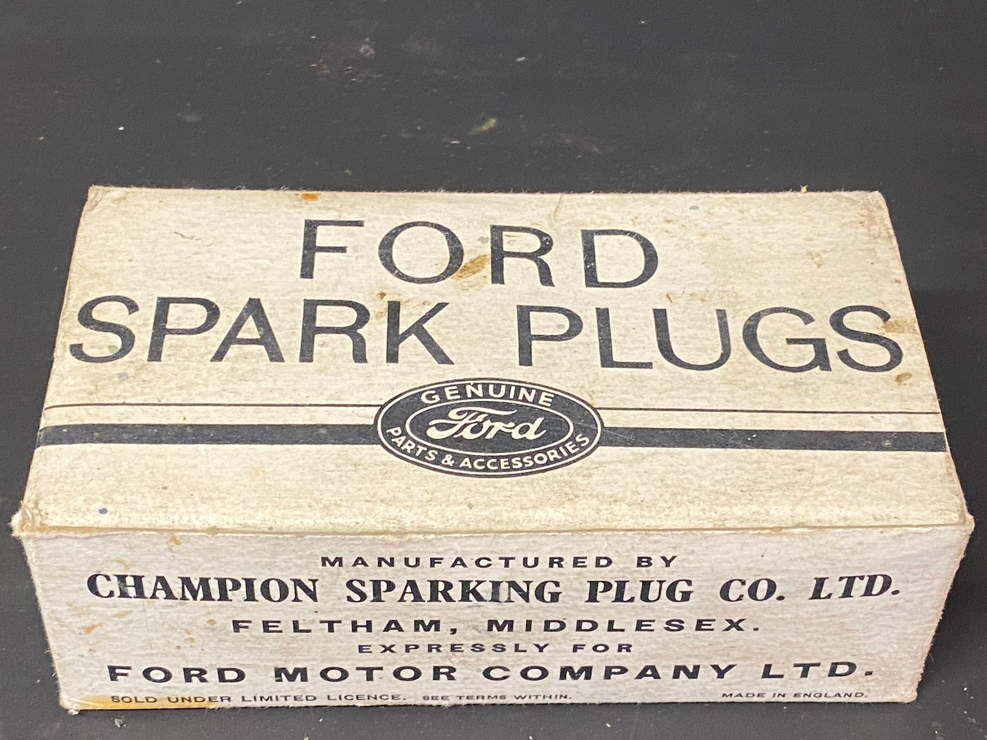 A Ford Spark Plugs cardboard box, manufactured by Champion Sparking Plug Co. Ltd expressly for