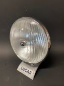 A 1950s Lucas spot lamp on sales display stand.