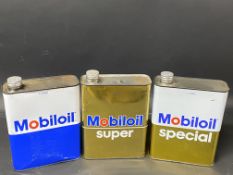 Three Continental Mobiloil one litre oil cans.