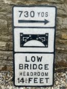 A 'Low Bridge Headroom 14 1/4 Feet' aluminium road sign, older repairs, 14 1/4 x 27 3/4".