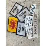A selection of road bollard perspex inserts and other signs.