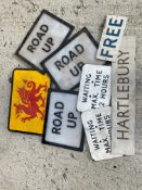 A selection of road bollard perspex inserts and other signs.