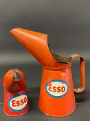 An Esso quart measure and another half pint version.