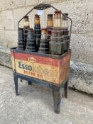 An Essolube Motor Oil eight division garage forecourt crate with wrap around tin sign and an