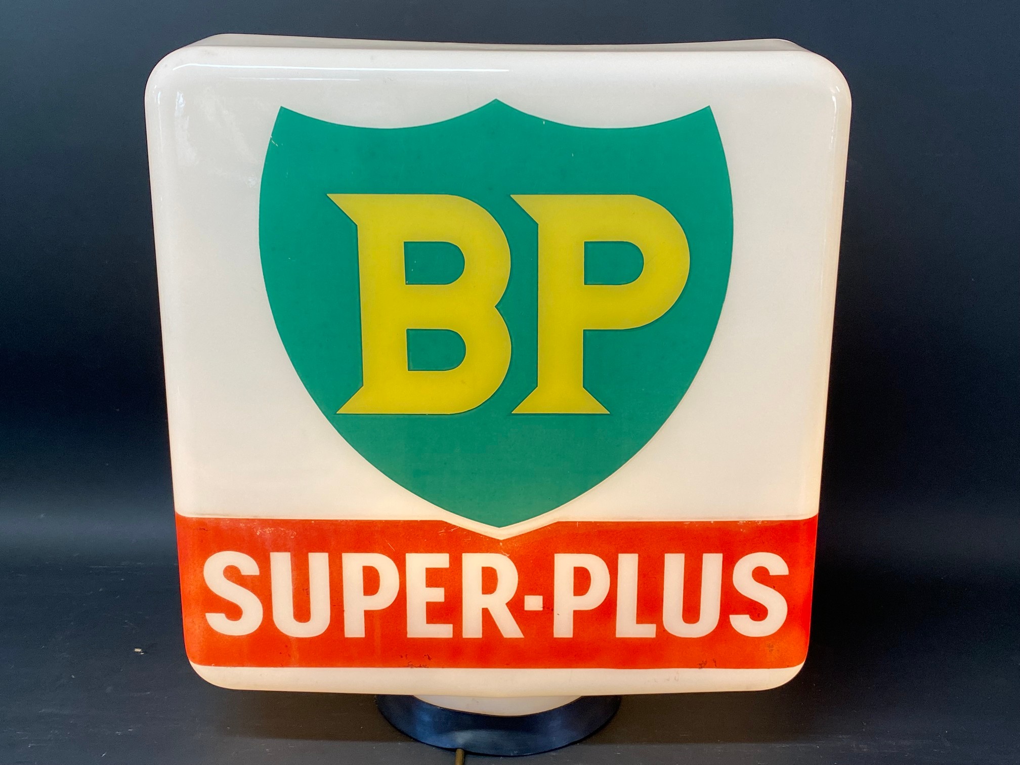 A BP Super-Plus glass petrol pump globe, chips to neck under rubber ring.