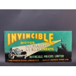 An Invincible Motor Insurance pictorial tin advertising sign with a scene of a ship's searchlight