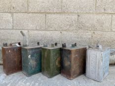 An assortment of two gallon petrol cans.