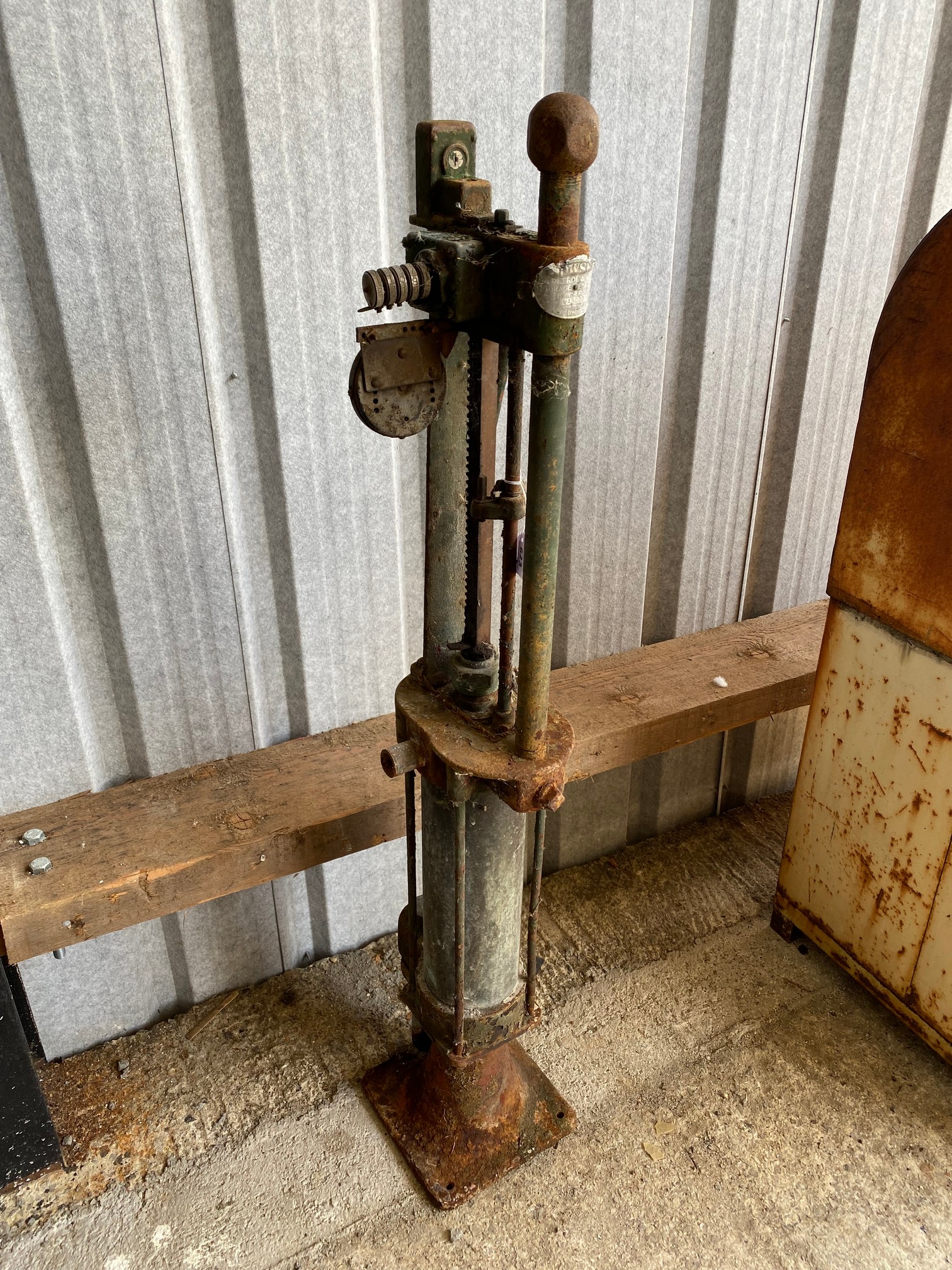 A skeleton petrol pump for restoration.