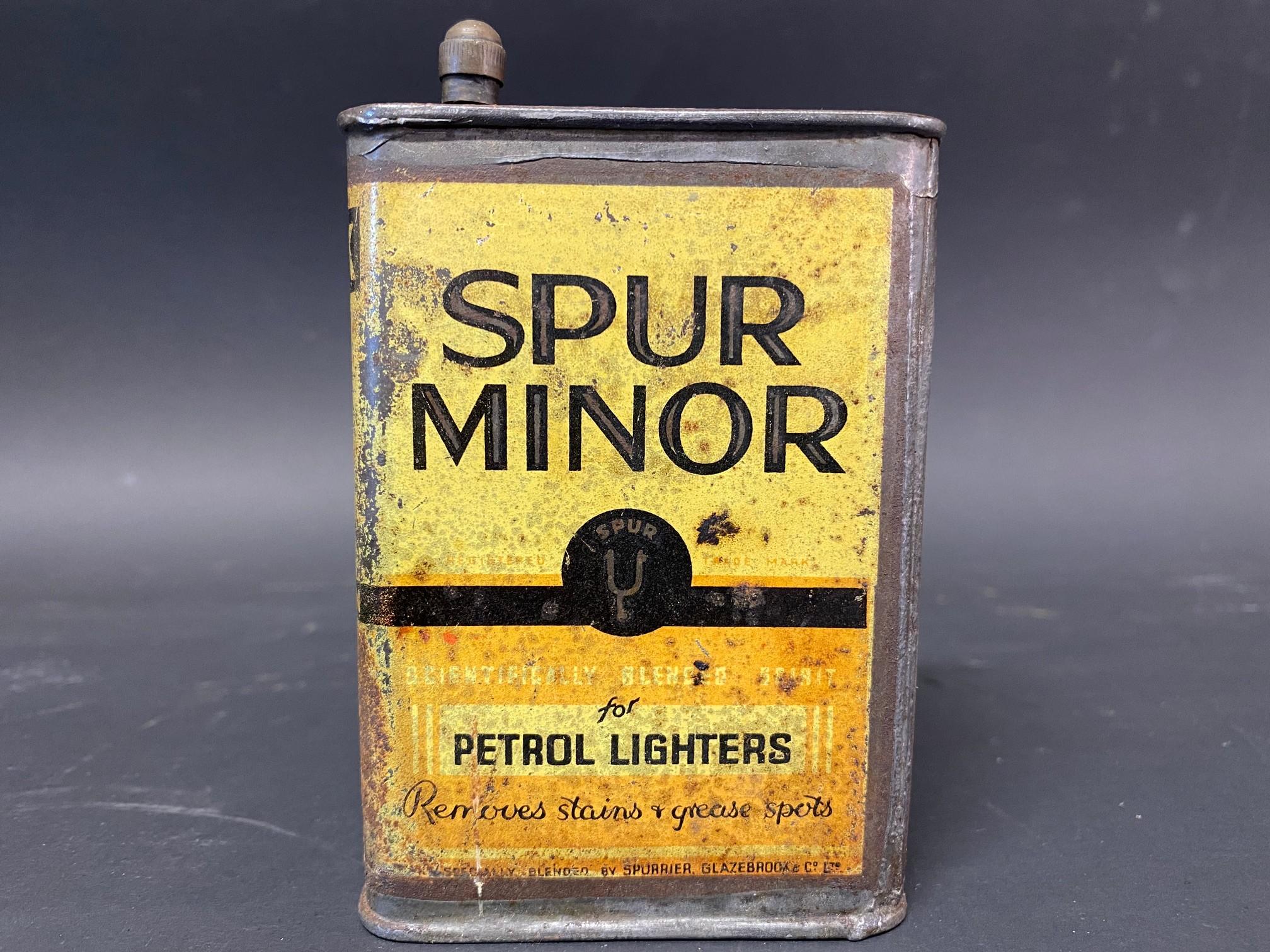 A small Spur Minor petrol lighters fuel tin.
