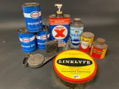A selection of assorted oil and other cans including Dunlop and Bow Bells.