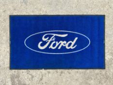 A Ford showroom carpet mat, 58 x 33".