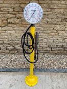 A Dunlop garage forecourt air and water meter, with a circular gauge and air line fittings.