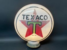 A Texaco glass petrol pump globe, unusually with raised letters and metal screw thread.