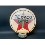 A Texaco glass petrol pump globe, unusually with raised letters and metal screw thread.