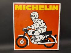 A Michelin double sided pictorial aluminium advertising sign depicting Mr Bibendum riding a