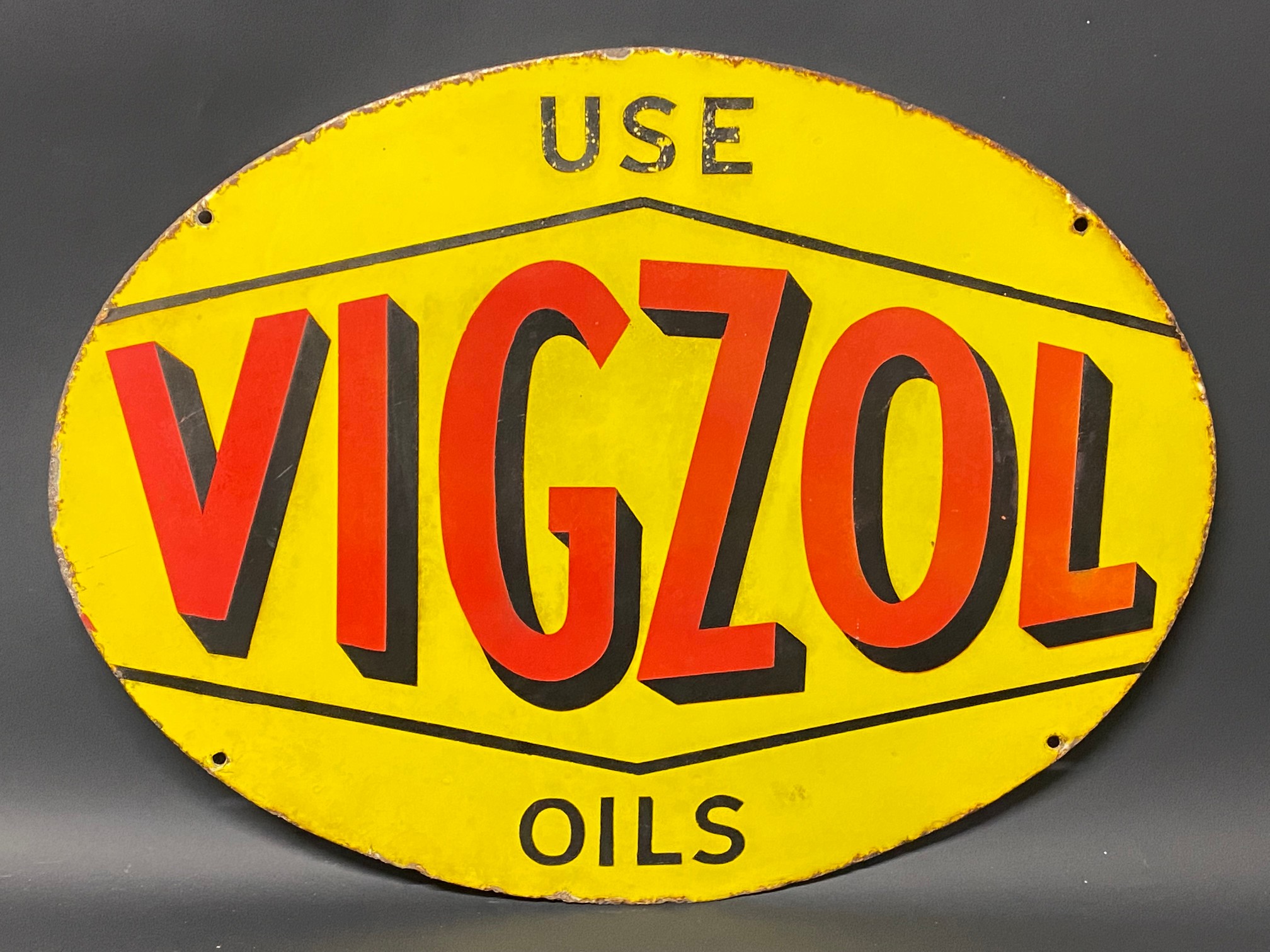 A Vigzol Oils oval double sided enamel sign in good condition, 24 x 18".