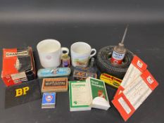 A tray of motoring collectables including a Shell branded mug, motoring related playing cards,