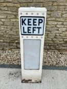 A metal Keep Left bollard, 44" h.